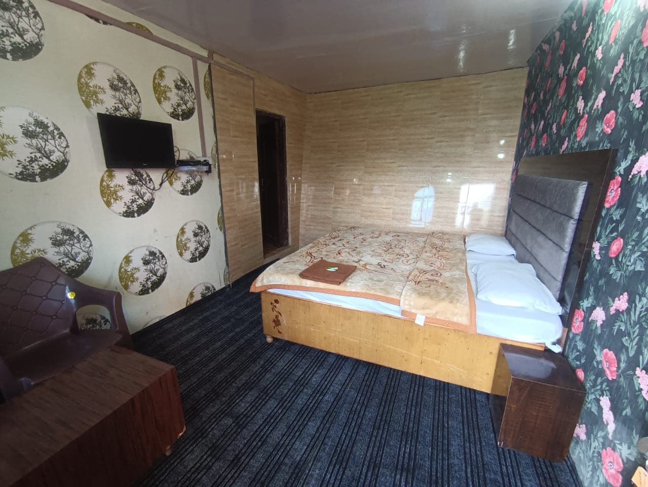 Double bed room with LED TV at Karan Resort